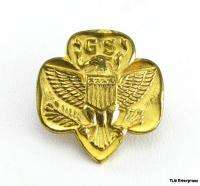 This pin features the letters GS above an eagle crest emblem. The back 