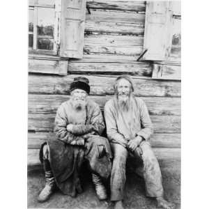   log house, full length, Russia / M. Dmitriev. Two men seated, Home