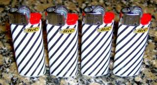 LOT OF 4 MINI BIC LIGHTERS FREE SHIP THESE WILL GO FAST