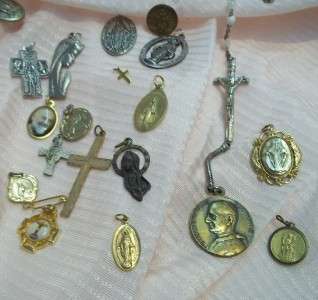assortment lot of religious medals crosses rosary beads  