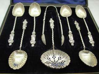   ANTIQUE CASED SOLID SILVER APOSTLE SPOONS,STRAINER,AND TONGS.  