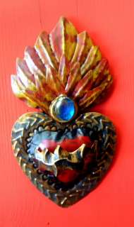   and painted repoussed heart by Mexican tin artisan, Paulo Cortes