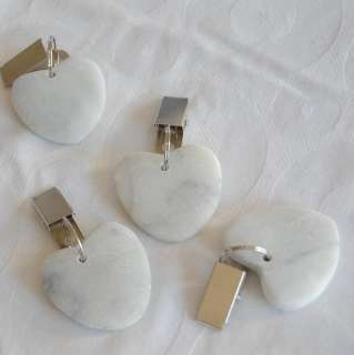 delightful set of 4 stone heart shaped table cloth weights. Clip 